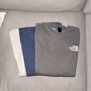The North Face Gray, Blue, and Cream Sweatshirts